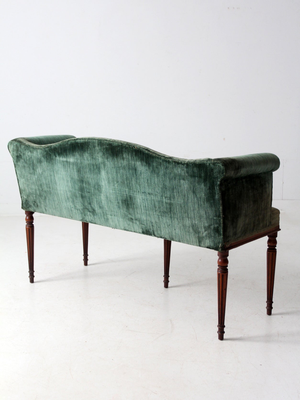 antique Neoclassical settee with velvet upholstery
