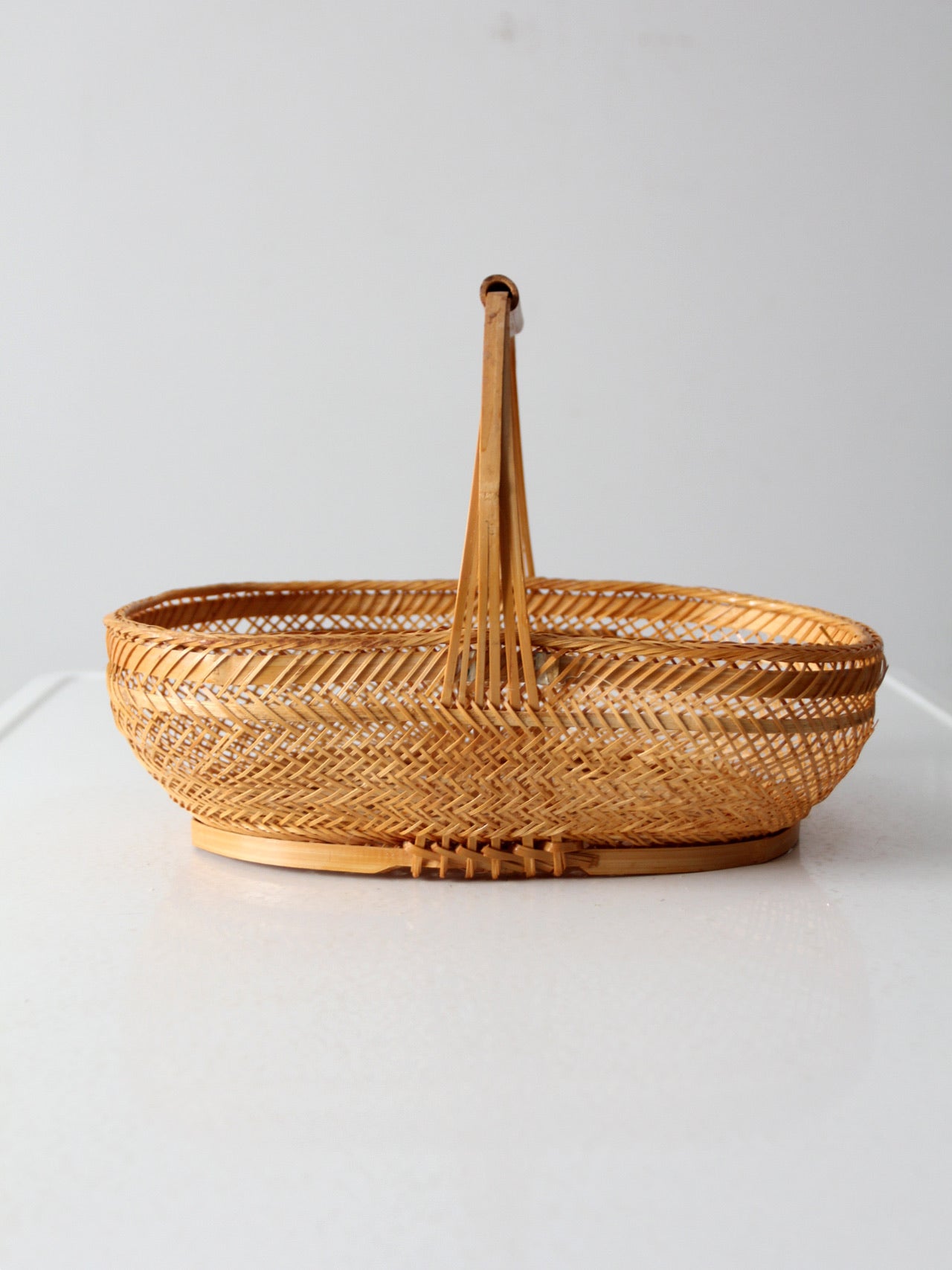 vintage 1970s rattan basket with handle