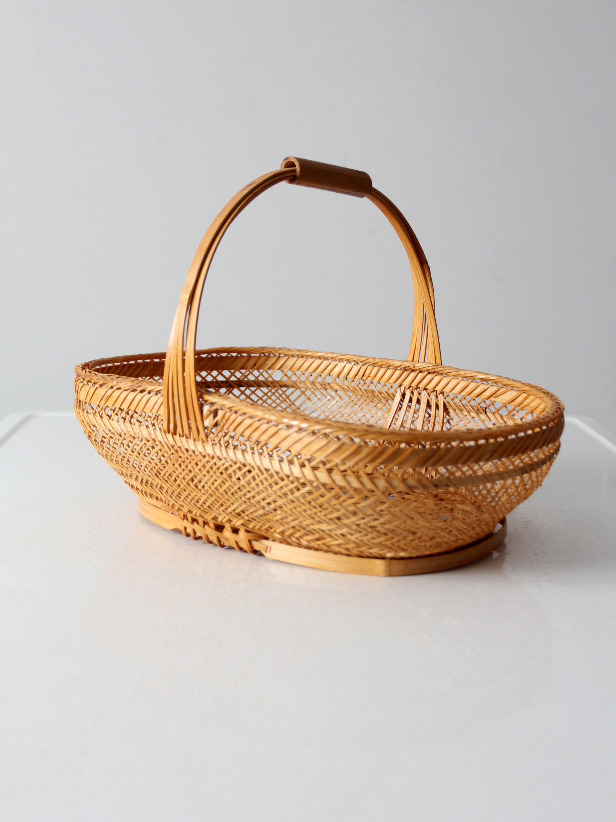 vintage 1970s rattan basket with handle