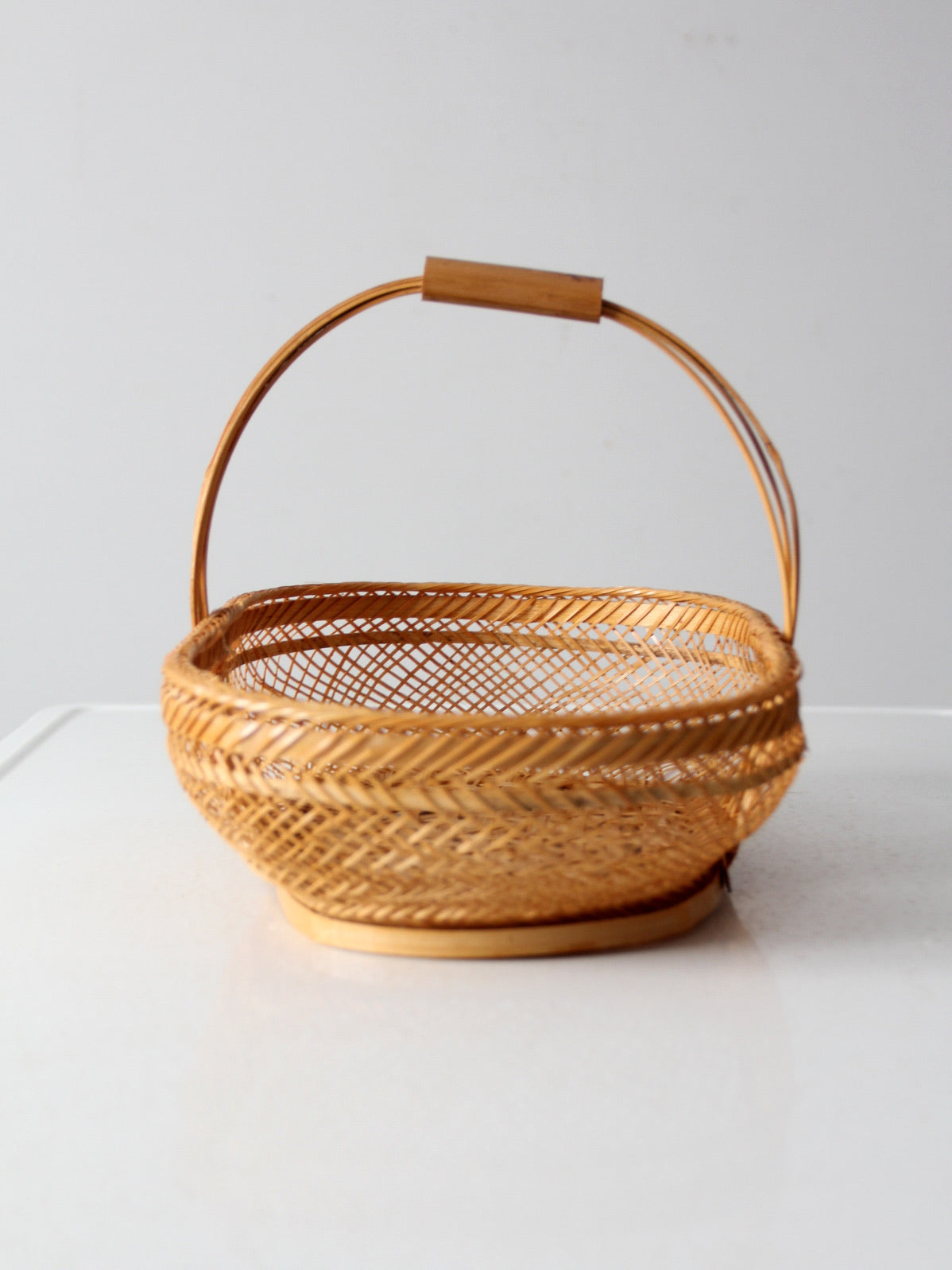 vintage 1970s rattan basket with handle