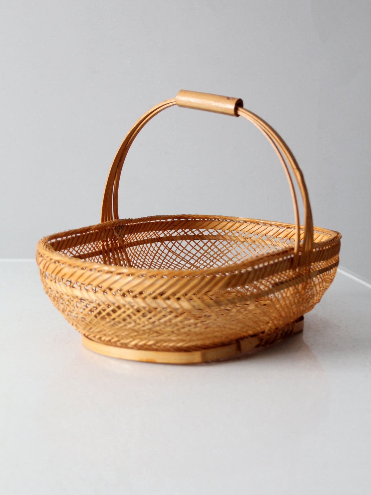 vintage 1970s rattan basket with handle