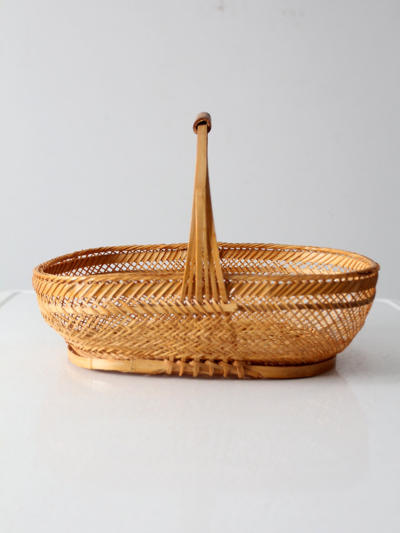 vintage 1970s rattan basket with handle