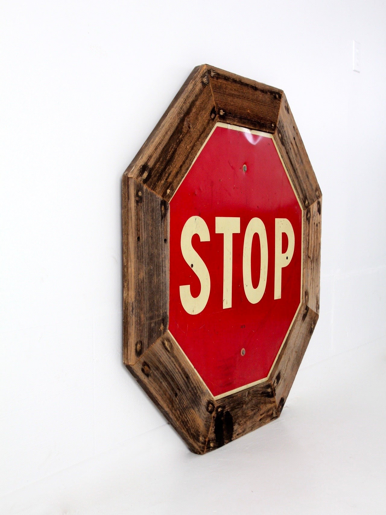 vintage Stop sign with barn wood frame