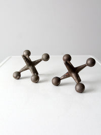 mid-century cast iron jacks pair