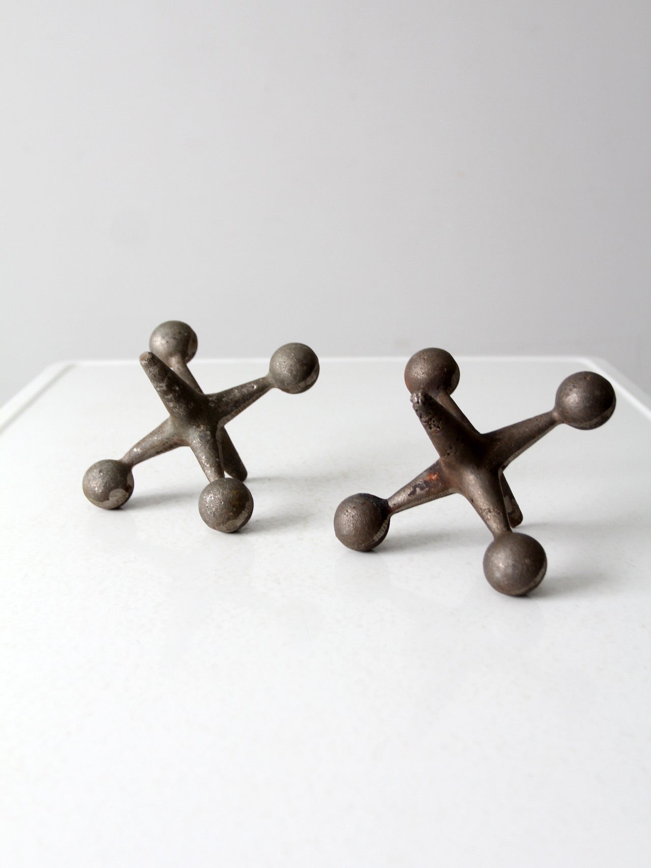mid-century cast iron jacks pair