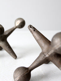 mid-century cast iron jacks pair