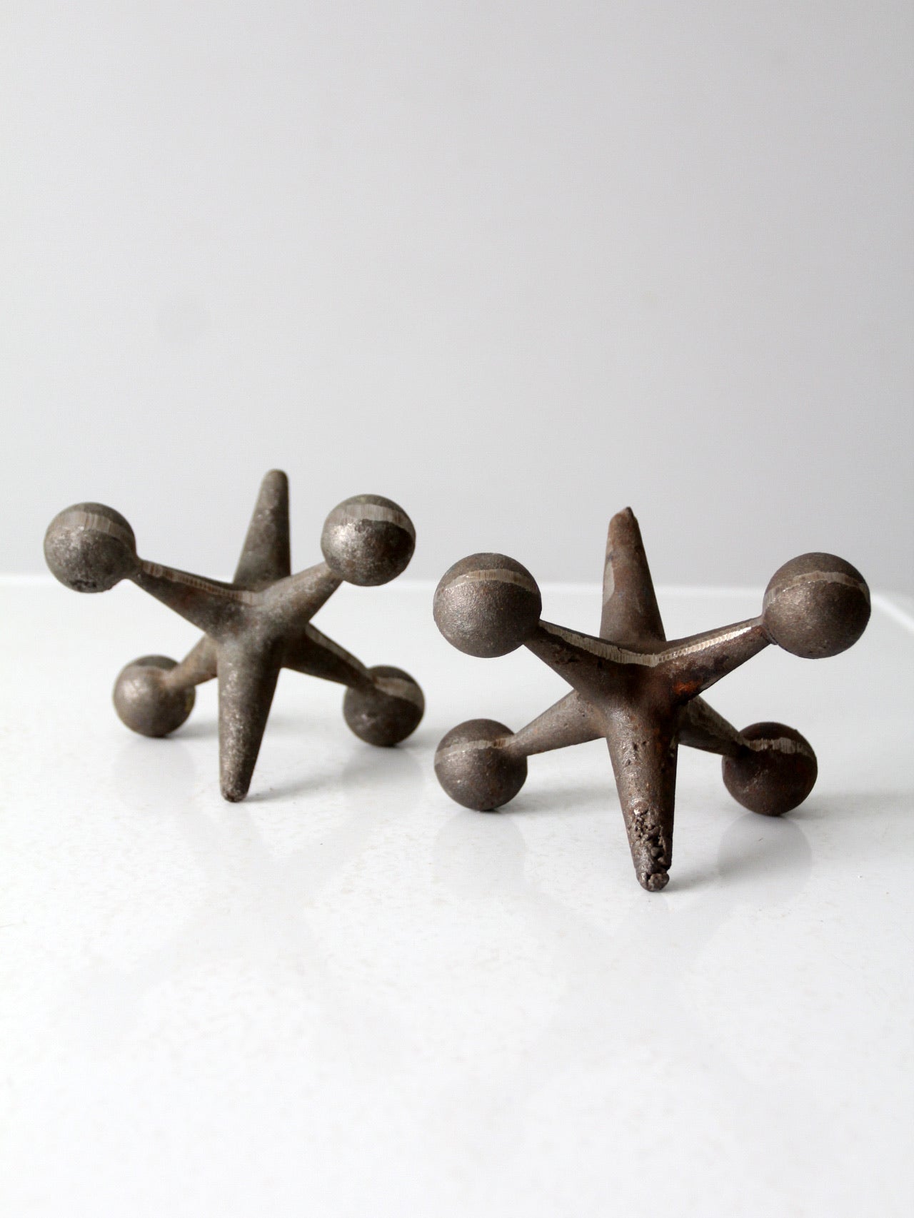 mid-century cast iron jacks pair