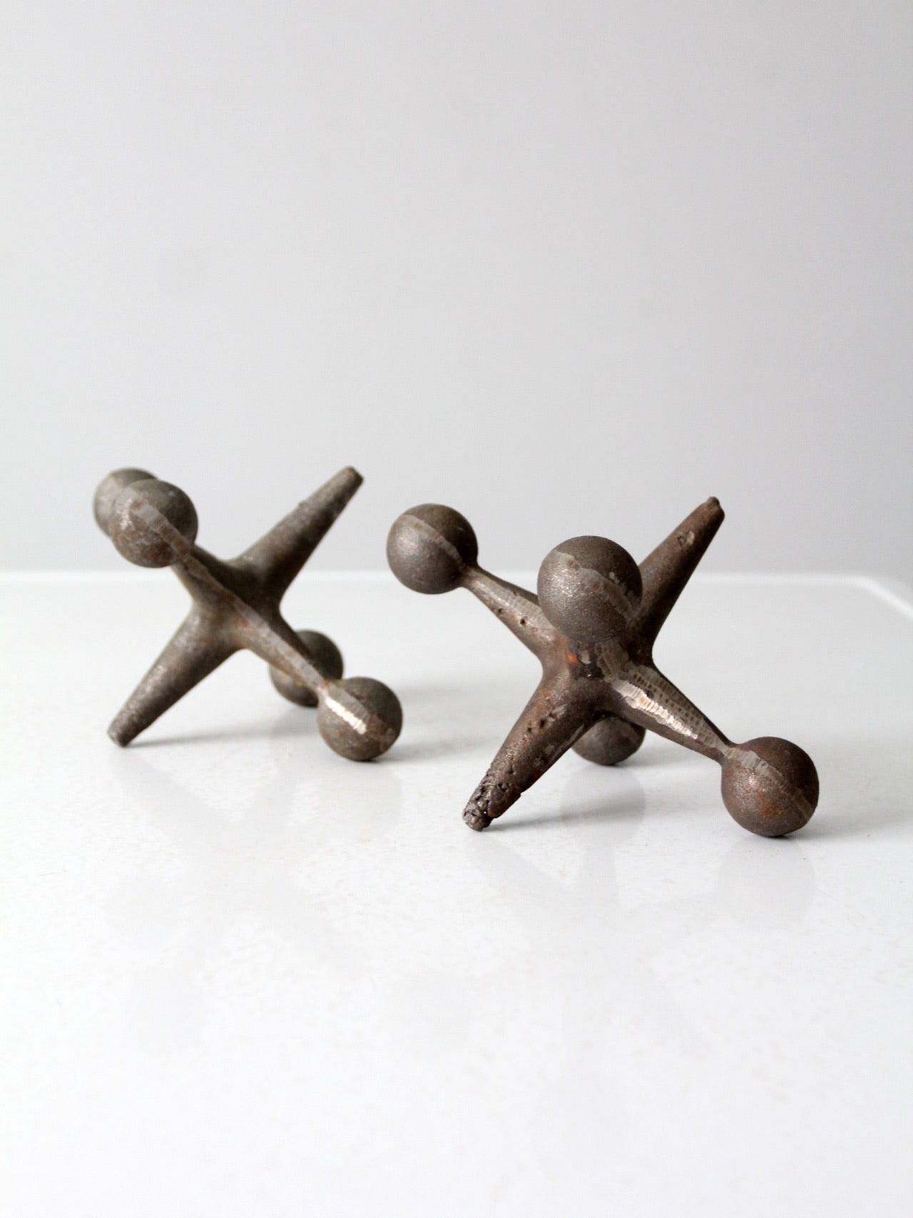 mid-century cast iron jacks pair