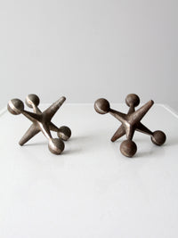 mid-century cast iron jacks pair
