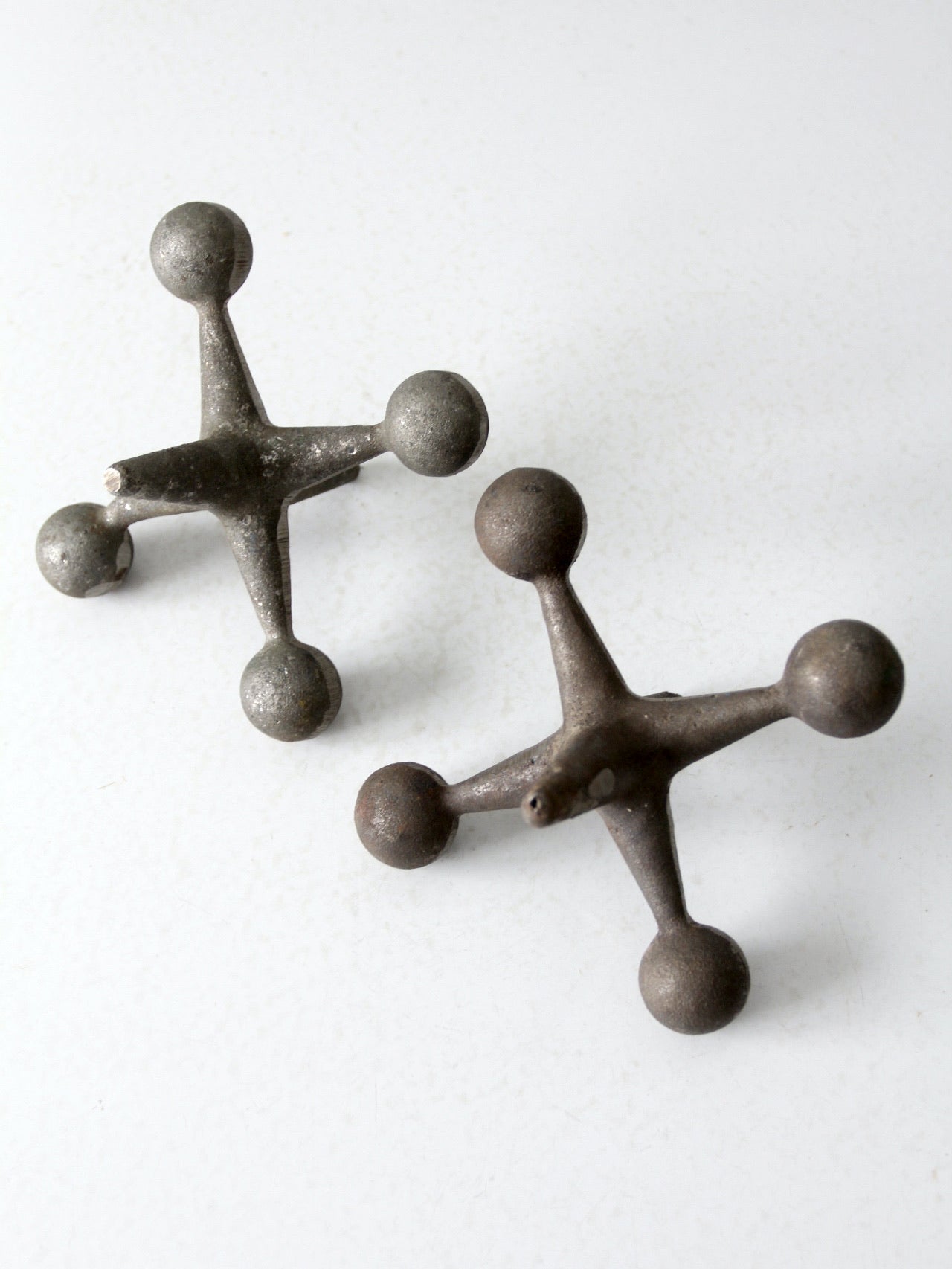 mid-century cast iron jacks pair