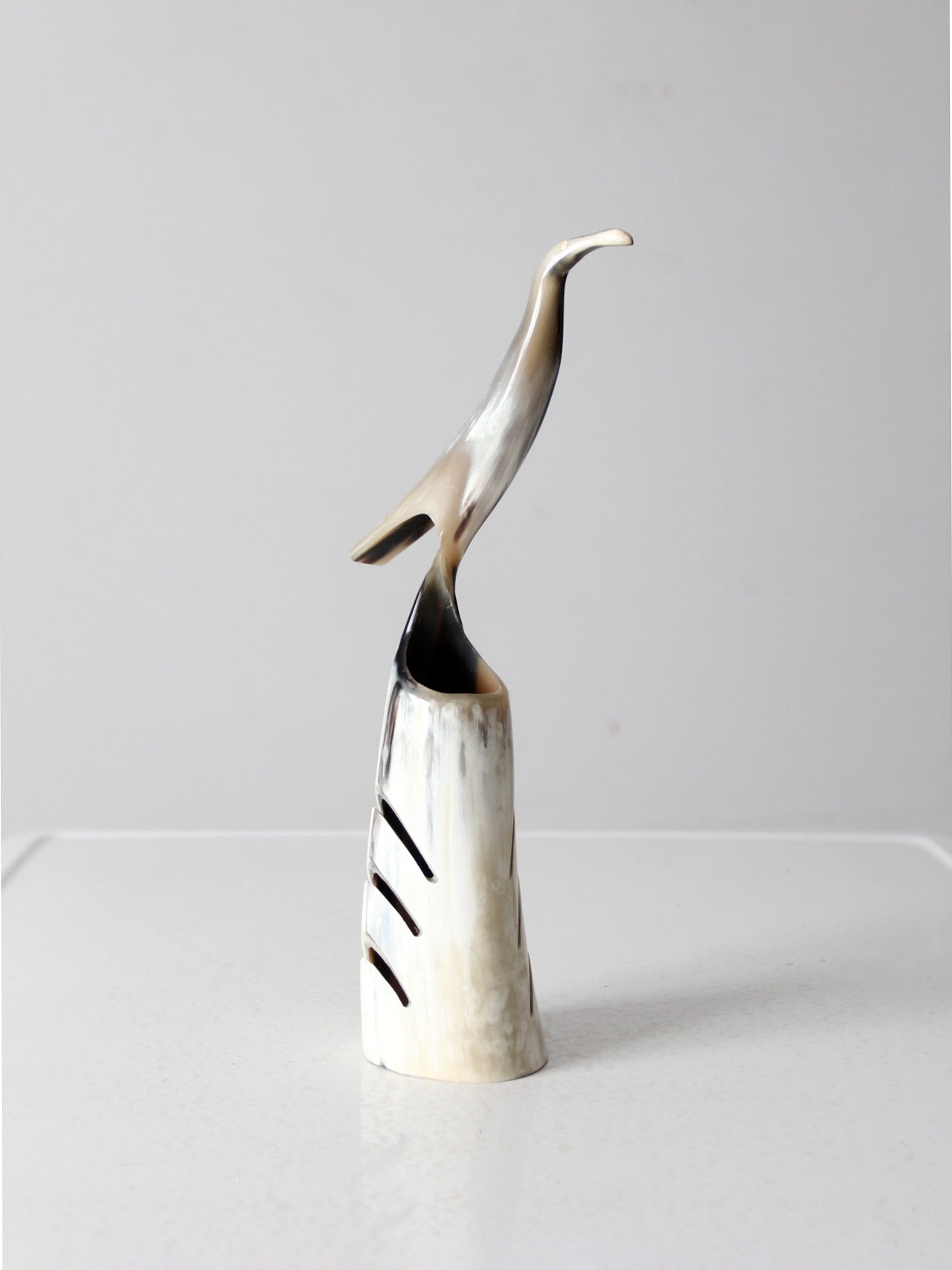 vintage polished horn bird sculpture