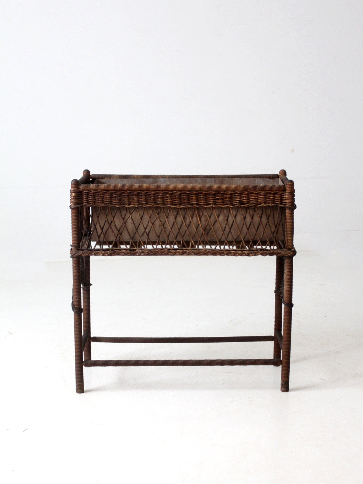 antique wicker planter stand