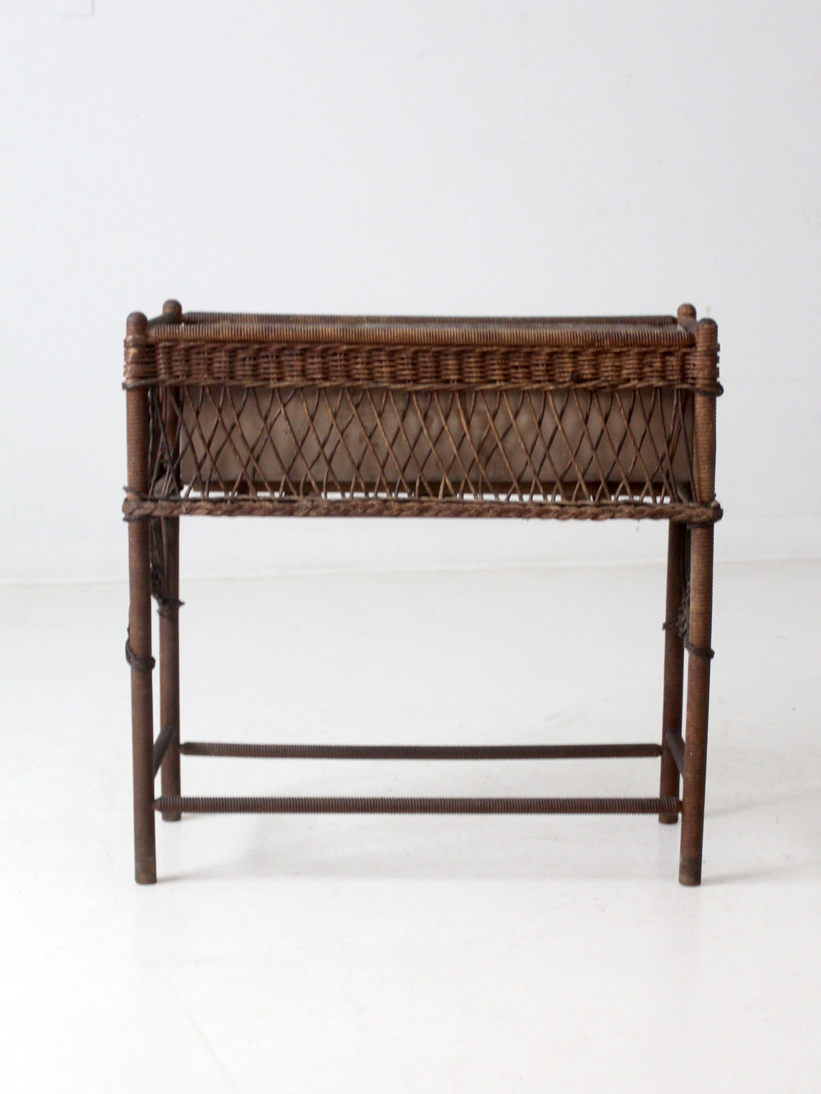 antique wicker planter stand