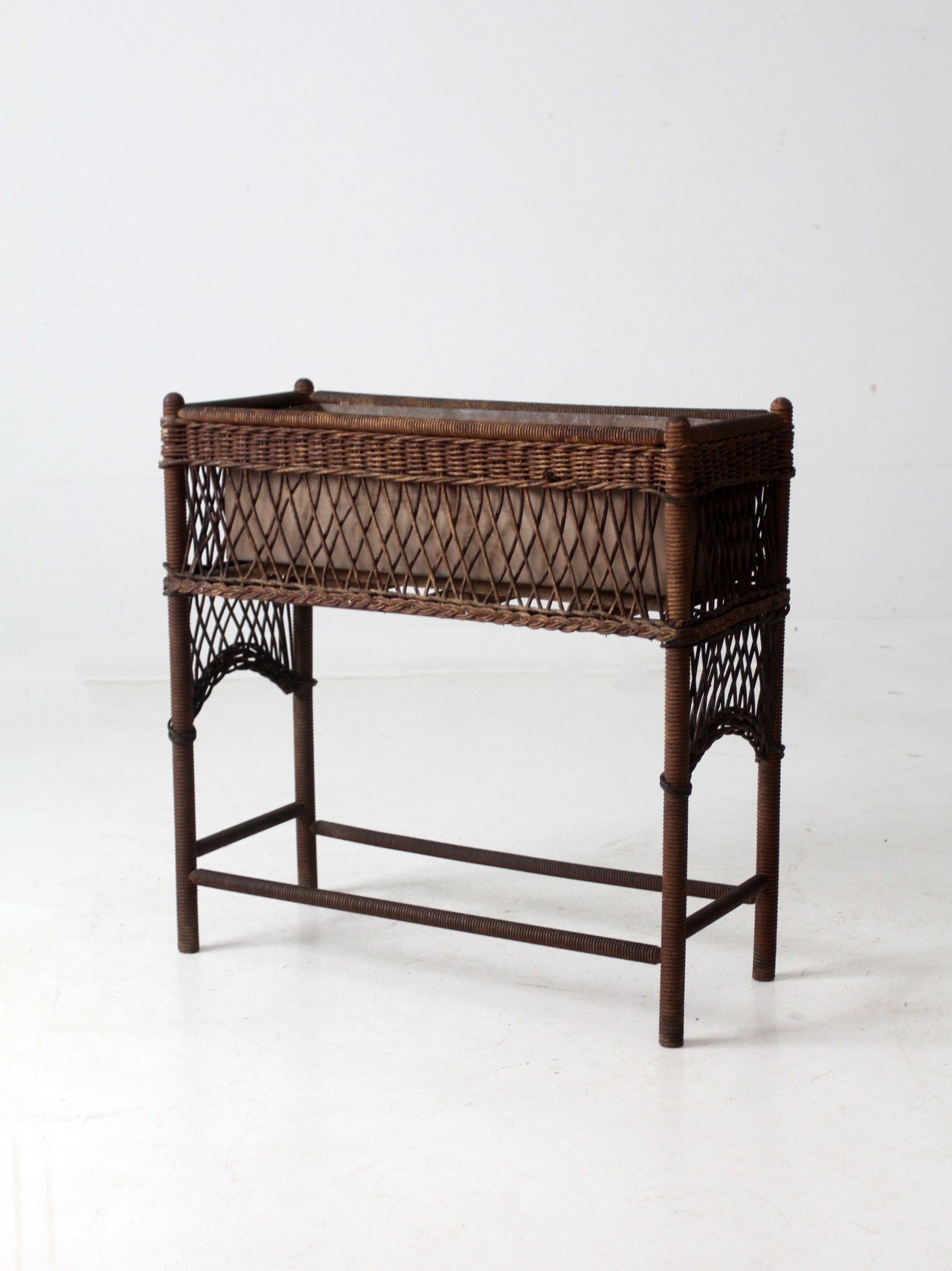 antique wicker planter stand