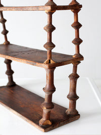 antique folk art spool shelf