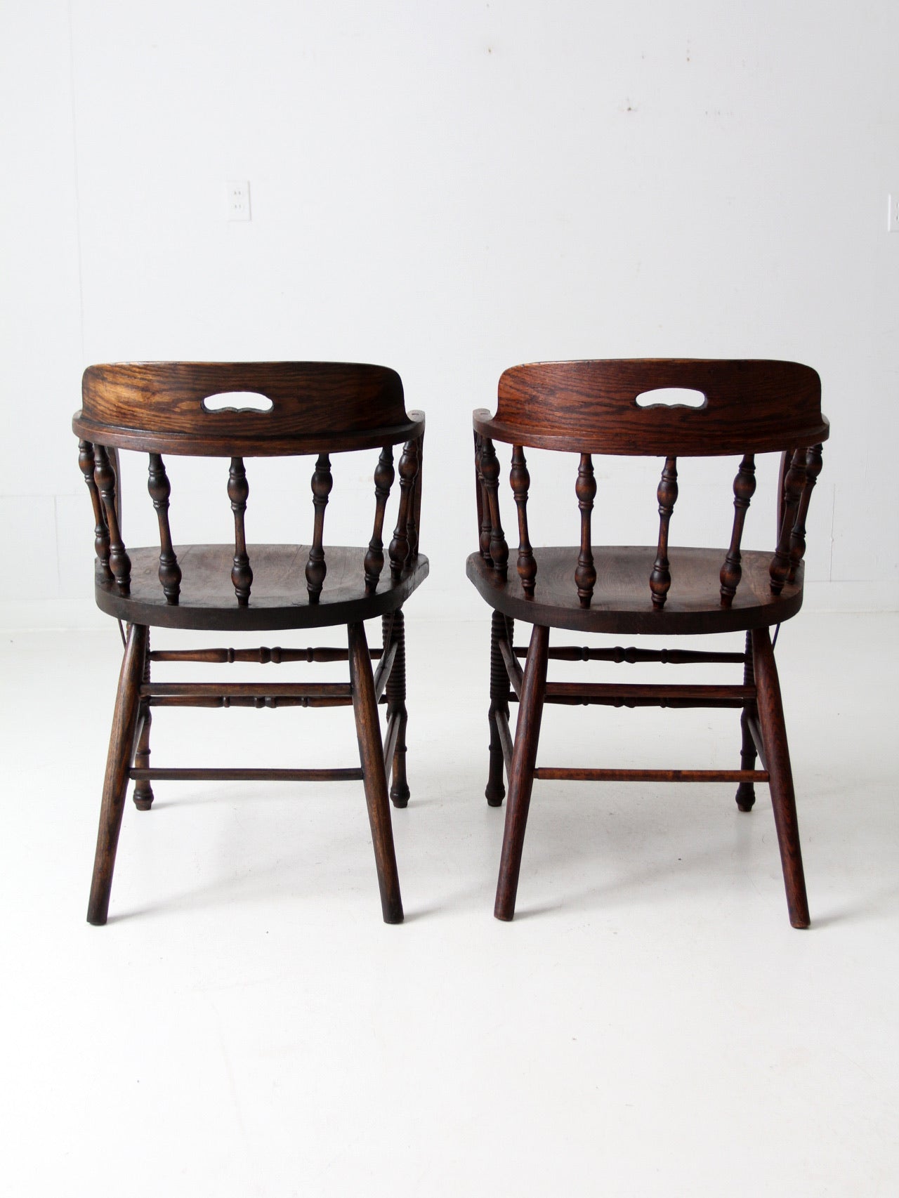 antique captains chair pair