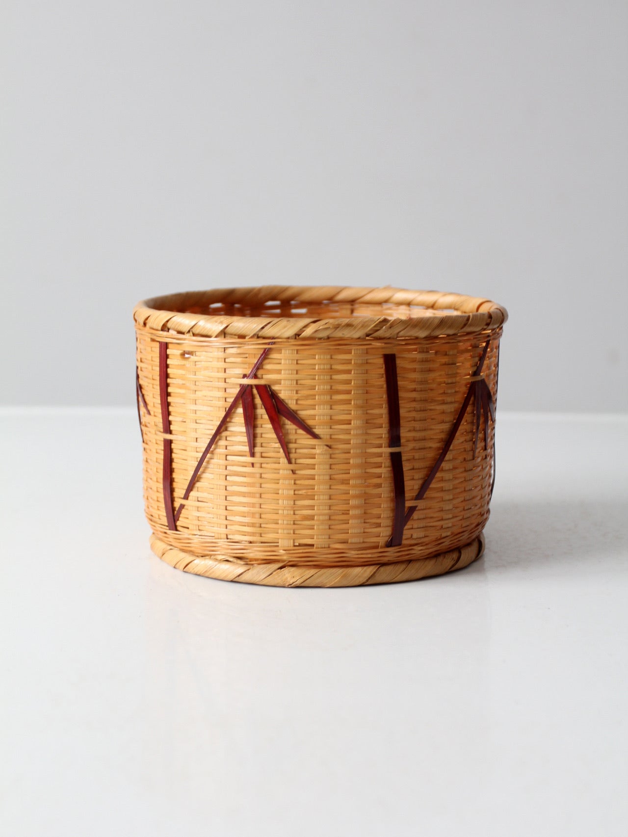 vintage woven basket with bamboo motif