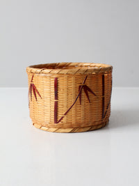vintage woven basket with bamboo motif