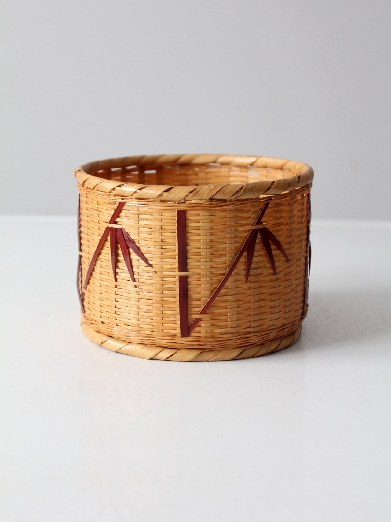vintage woven basket with bamboo motif