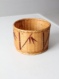 vintage woven basket with bamboo motif