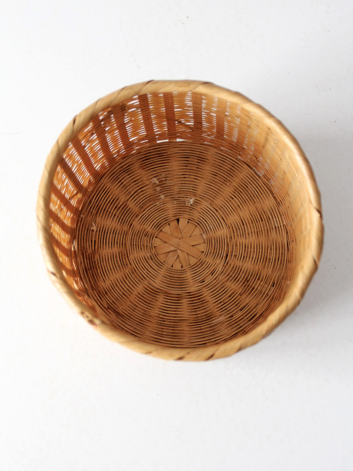 vintage woven basket with bamboo motif