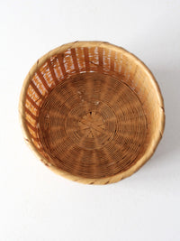 vintage woven basket with bamboo motif