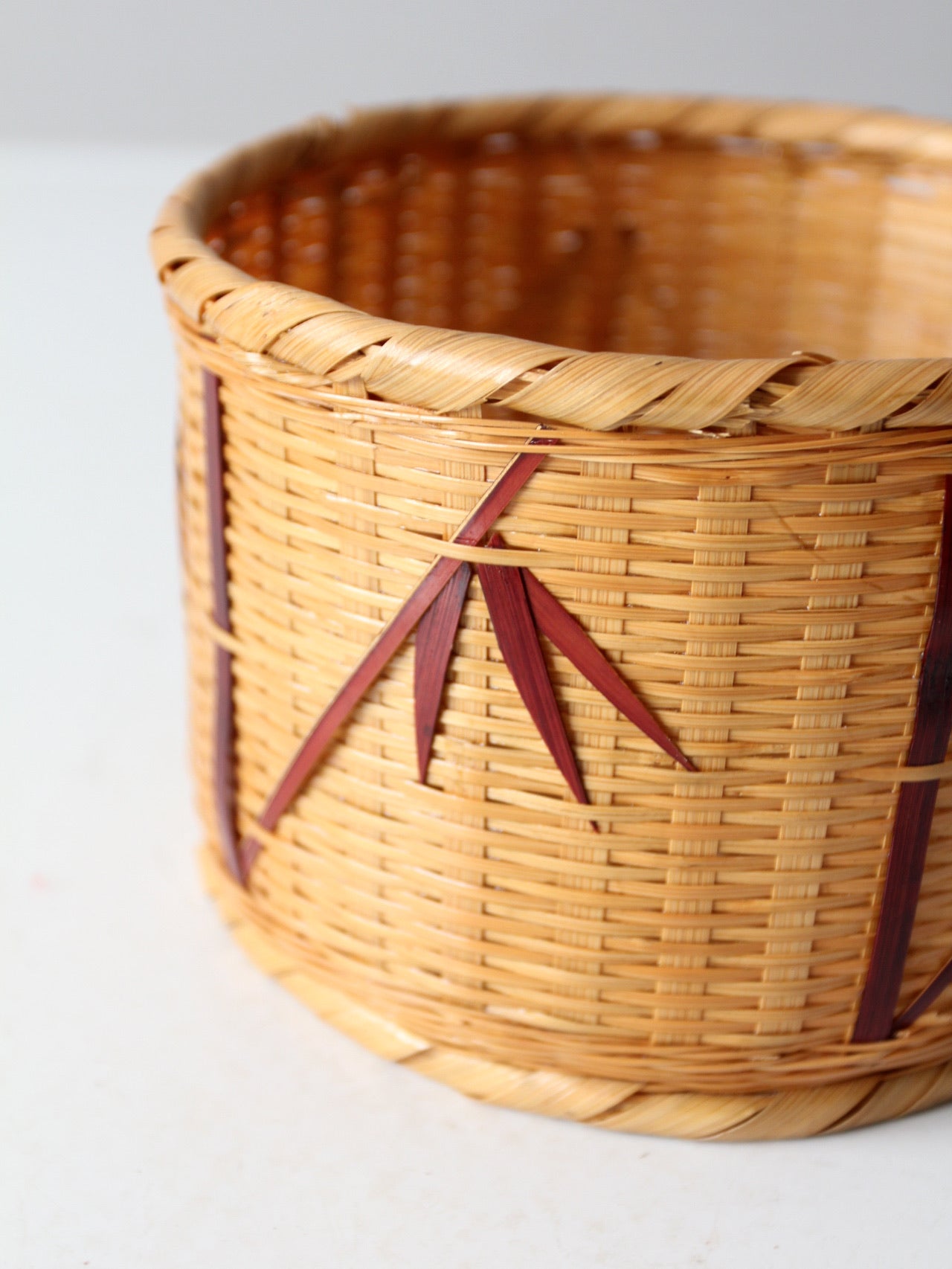 vintage woven basket with bamboo motif