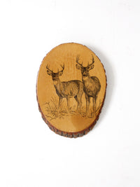 vintage deer wall art on wood slab