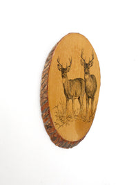 vintage deer wall art on wood slab
