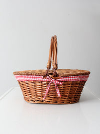 vintage wicker picnic basket with gingham lining