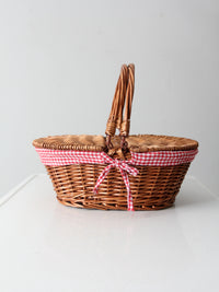 vintage wicker picnic basket with gingham lining