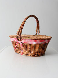vintage wicker picnic basket with gingham lining