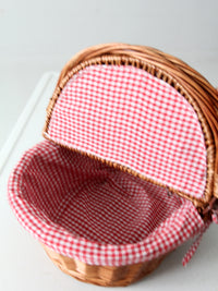 vintage wicker picnic basket with gingham lining