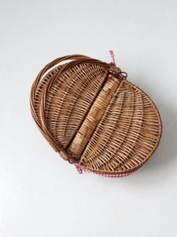 vintage wicker picnic basket with gingham lining