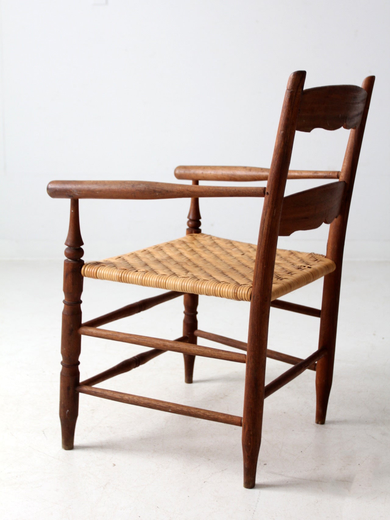 antique woven seat armchair