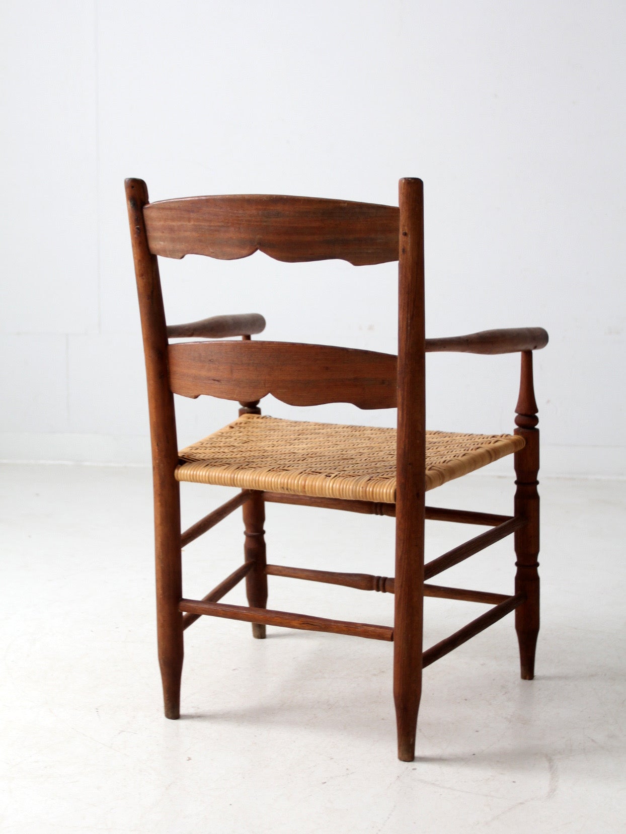 antique woven seat armchair