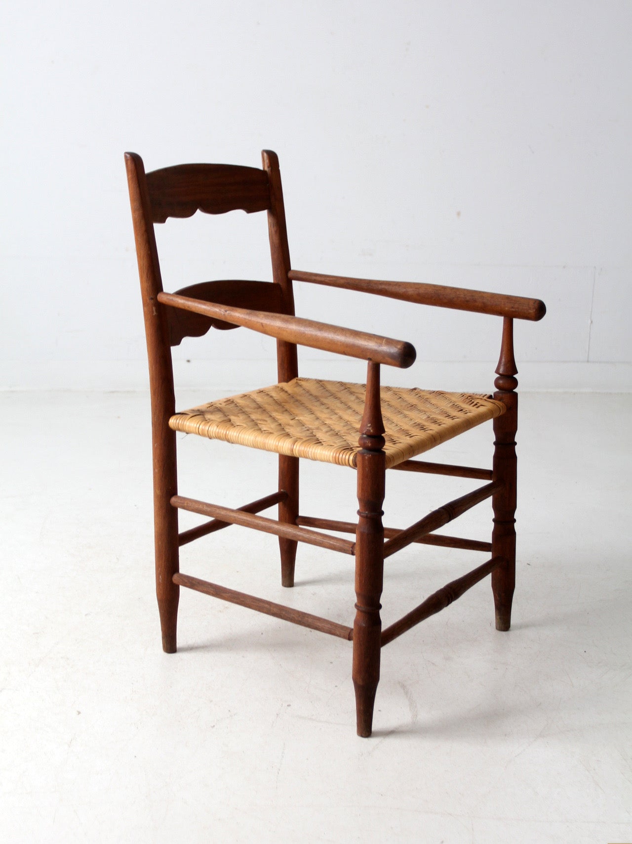 antique woven seat armchair
