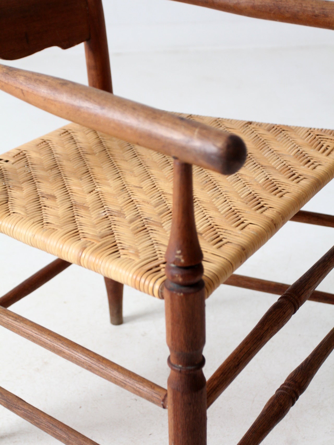 antique woven seat armchair