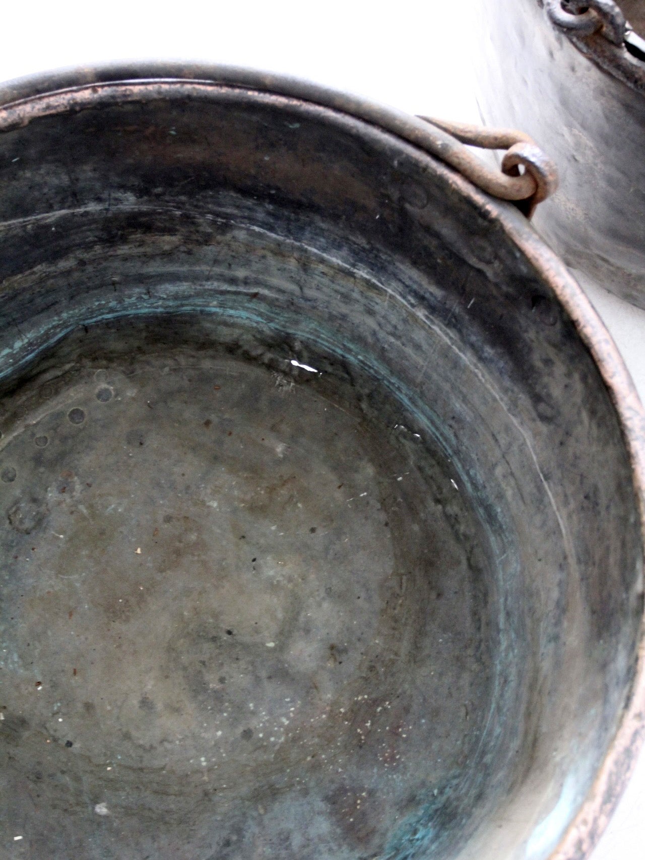 antique copper pot with iron handle