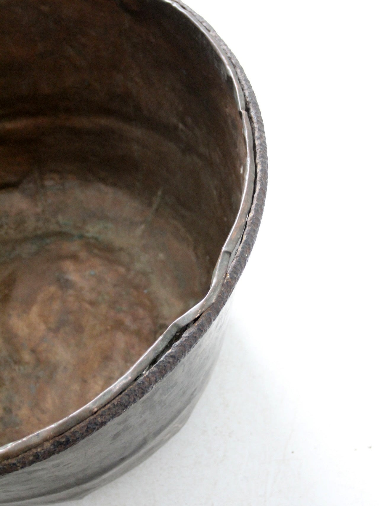 antique copper pot with iron handle