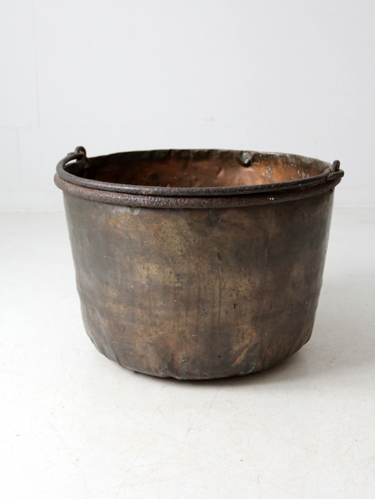 antique copper pot with iron handle