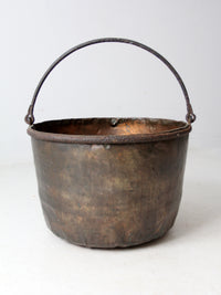 antique copper pot with iron handle