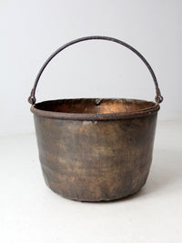 antique copper pot with iron handle