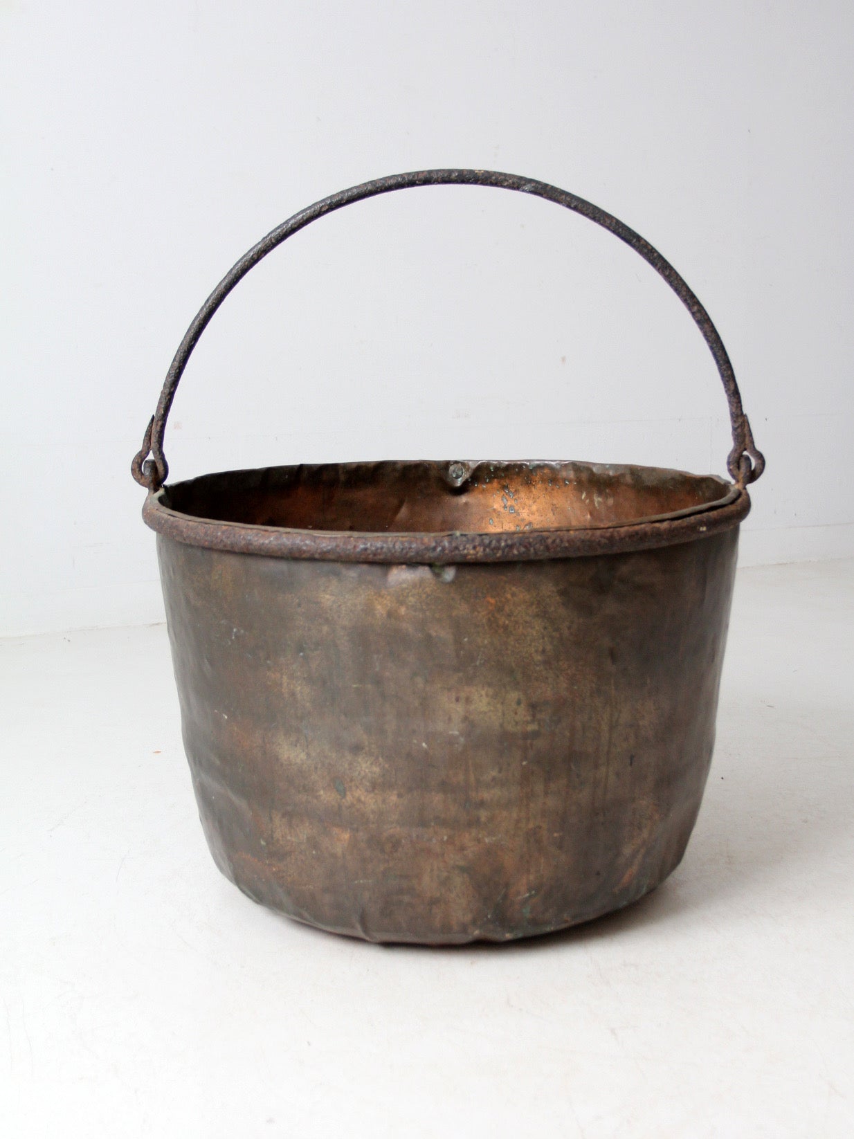 antique copper pot with iron handle