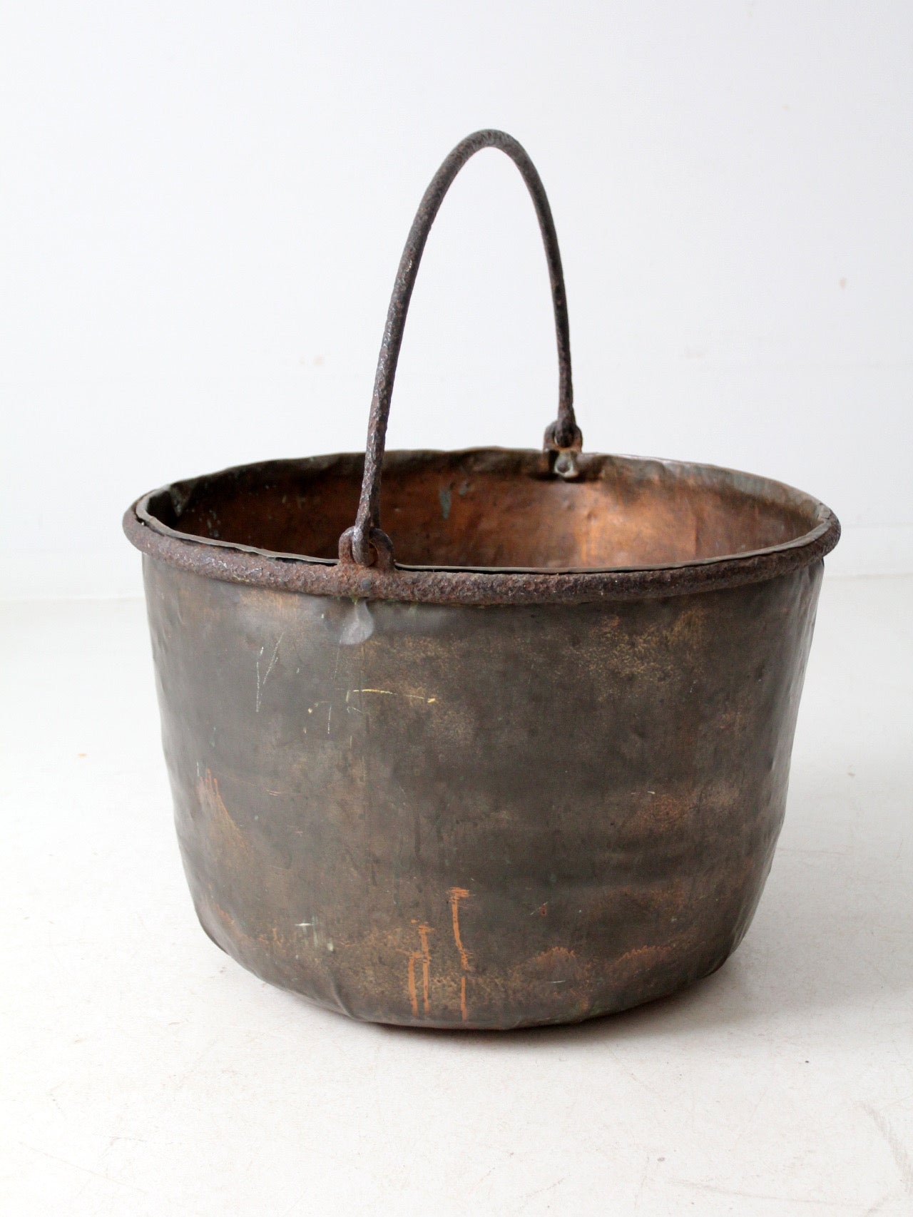antique copper pot with iron handle