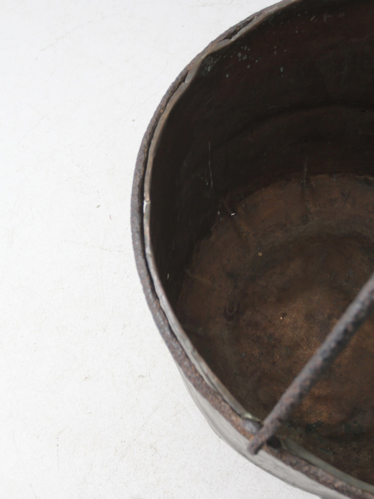 antique copper pot with iron handle