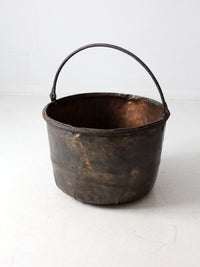 antique copper pot with iron handle