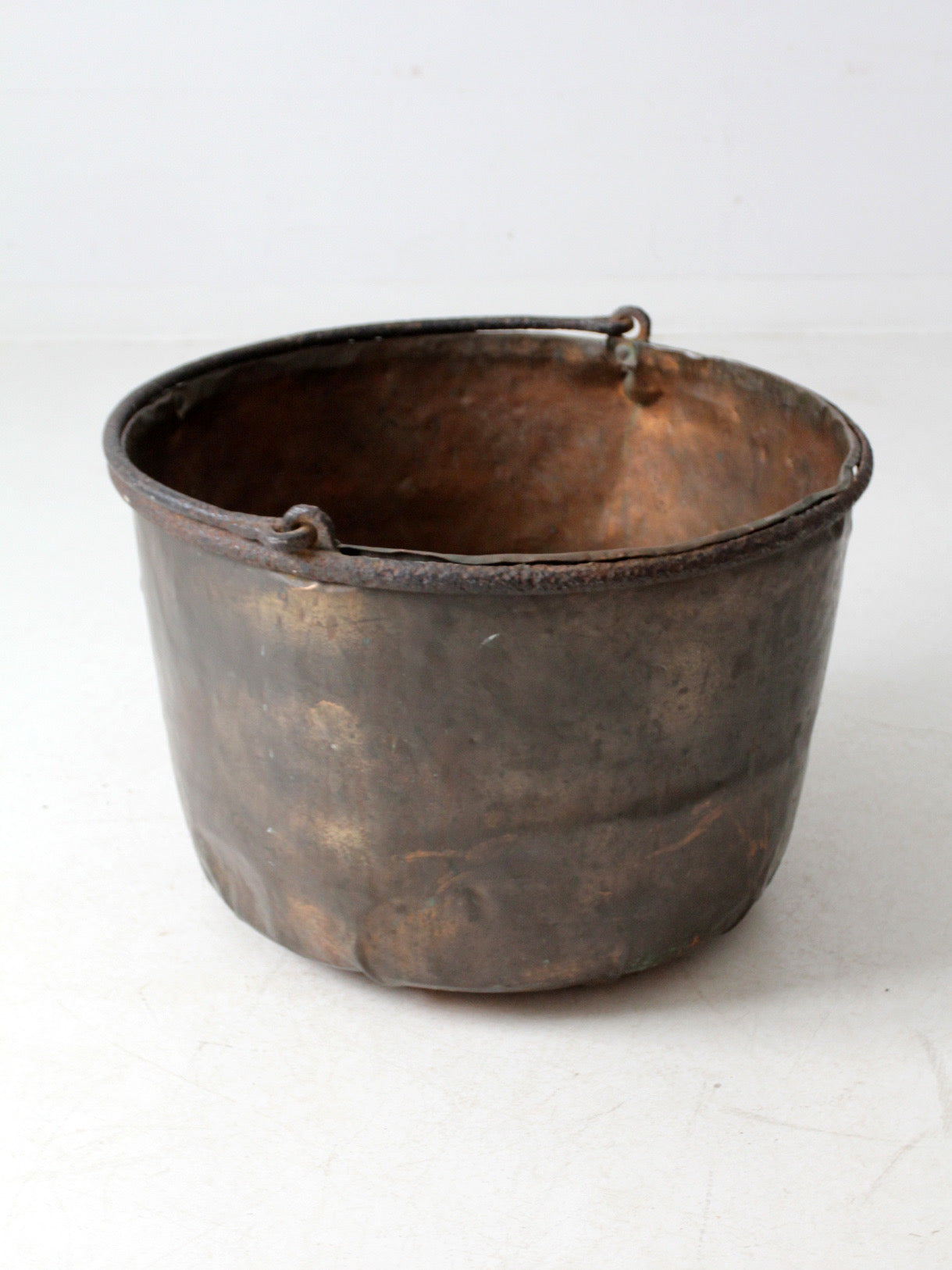 antique copper pot with iron handle