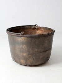 antique copper pot with iron handle
