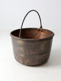 antique copper pot with iron handle